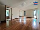 Spacious main living area with wooden flooring