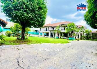 Exterior view of a house with a lush garden