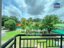 Balcony view with green surroundings