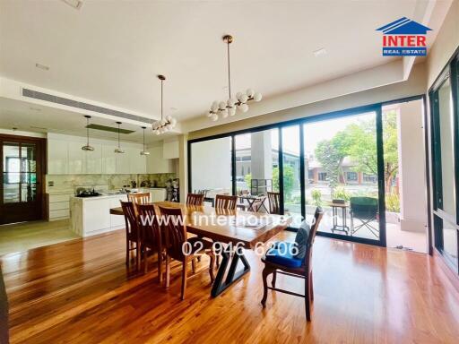 Spacious dining area with wooden flooring and large sliding glass doors