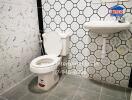 Bathroom with wall tiles, toilet, and sink