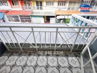 Balcony view with railing and tiled floor