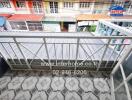 Balcony view with railing and tiled floor