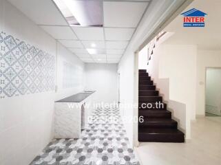 Modern kitchen with tiled walls and flooring