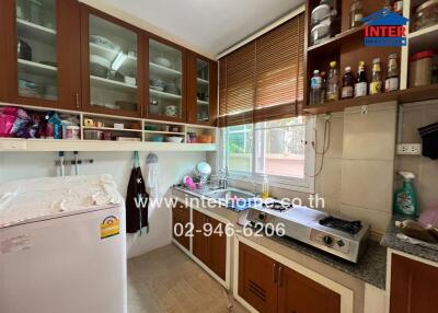 Modern kitchen with brown cabinets and appliances