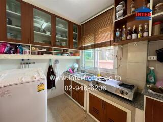 Modern kitchen with brown cabinets and appliances