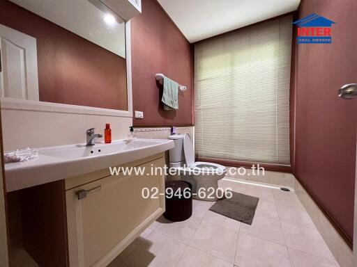 Modern bathroom with large mirror and sink