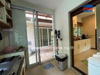 Modern kitchen with sliding glass door and access to outdoor space