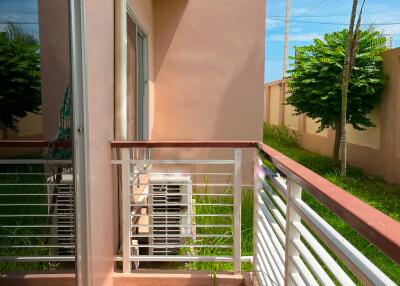 Small balcony with railing and air conditioning unit