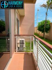 Small balcony with railing and air conditioning unit