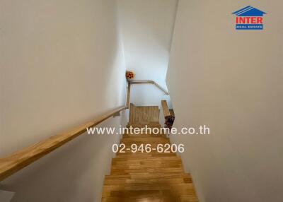 Wooden staircase with handrails