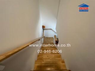 Wooden staircase with handrails