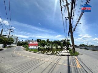 Street view with adjacent property for sale