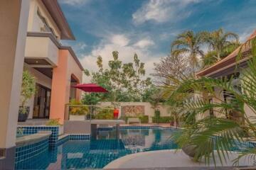 outdoor pool area with view of house