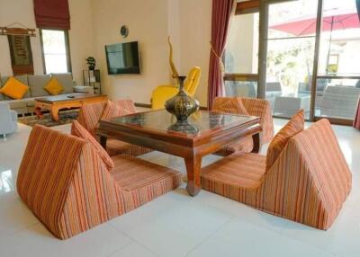 Living room with low-seating floor furniture and decor