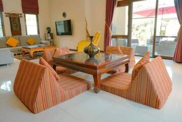 Living room with low-seating floor furniture and decor