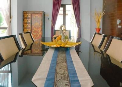 Formal dining room with decorative table and chairs