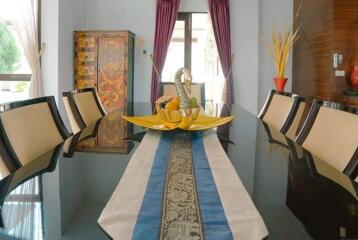 Formal dining room with decorative table and chairs