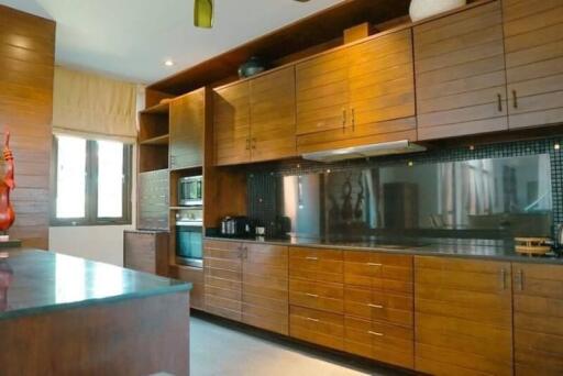 Spacious kitchen with modern wooden cabinetry