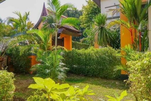 Lush garden space with palm trees and greenery