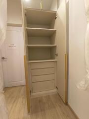 Spacious built-in storage cabinet with open shelves and drawers