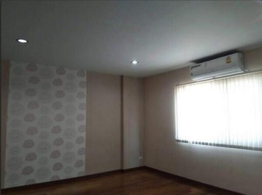 Spacious bedroom with air conditioning and natural light