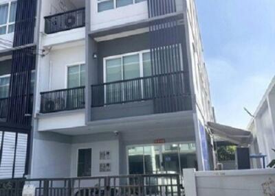 Exterior view of a modern multi-story townhouse