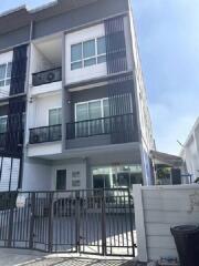 Exterior view of a modern multi-story townhouse