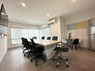 Modern office with conference table and chairs