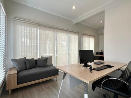 Modern office space with desk and seating area