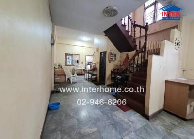 Spacious living area with staircase