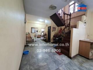 Spacious living area with staircase