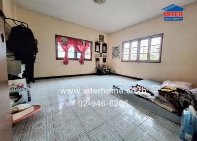 Bedroom with tiled floor and simple furnishings