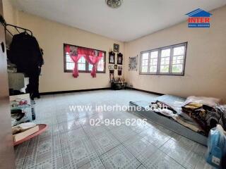 Bedroom with tiled floor and simple furnishings