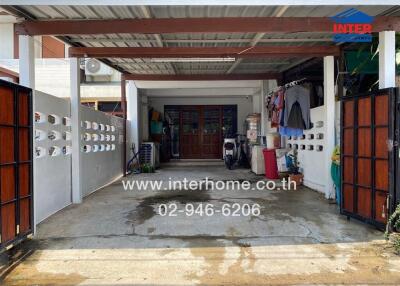 Covered garage with storage and scooters