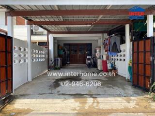 Covered garage with storage and scooters