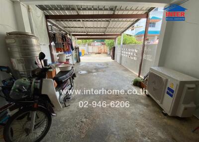 Garage with various items and covered roof