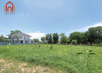 Front view of a house with a large grassy yard