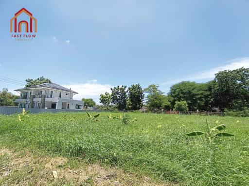 Front view of a house with a large grassy yard