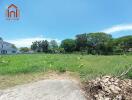 Spacious empty land with surrounding greenery