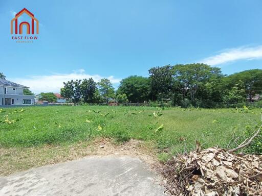 Spacious empty land with surrounding greenery