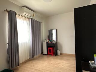 Bedroom with vanity and window