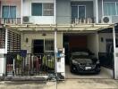 Front view of a two-story house with carport