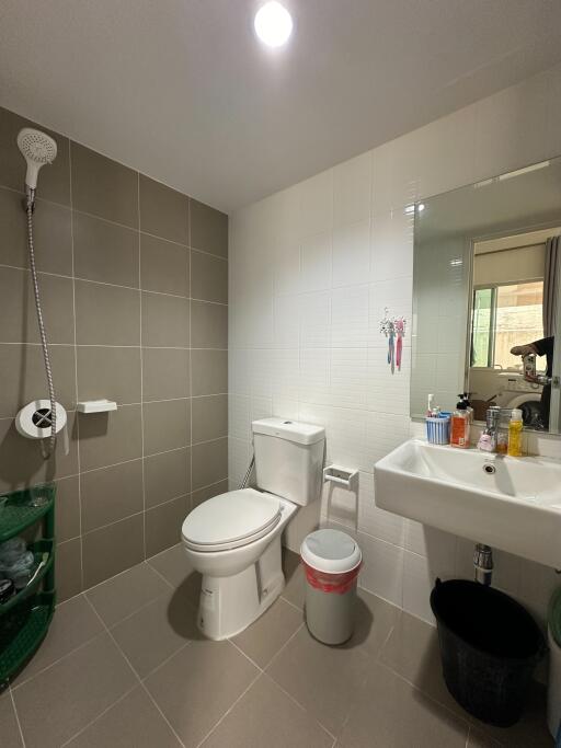 Modern bathroom with shower, toilet, and sink