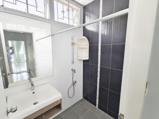 Modern bathroom with black and white tiles