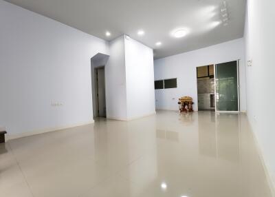 Spacious living room with polished tile floors