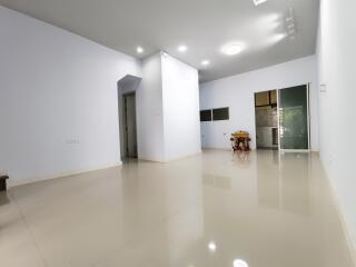 Spacious living room with polished tile floors