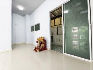 Spacious living area with a sliding glass door