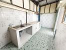 Simple kitchen with tiled flooring and backsplash