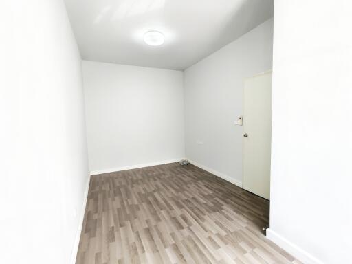 minimalist empty room with wooden floor